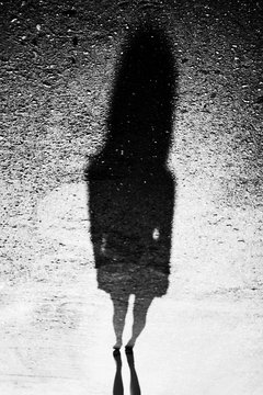Mystic female shadow. Woman silhouette. Abstract black white photo