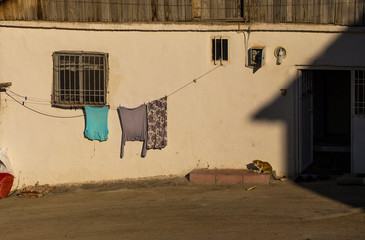 Laundry hanging on a wall of a house in Malatya suburbs