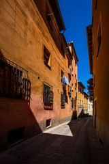 Narrow street between buildings in Segovia