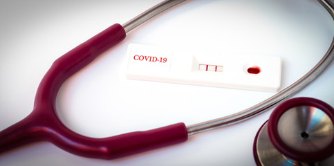 Doctor holding a test kit for viral disease COVID-19  Lab card kit test for viral novel,rapid test kit for corona virus covid-19