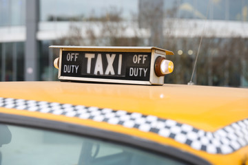 old taxi sign on a cab roof close up