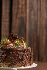 Tasty cake on  wooden background