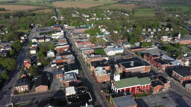 Low aerial orbit with camera pointed down showing the main street area of Charles Town, WV.