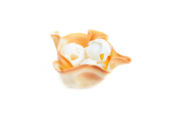 Obraz na płótnie Canvas White ice cream balls in waffle basket isolated on white background