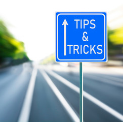Tips & Tricks Road Sign on a Speedy Background