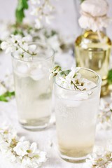 Fototapeta na wymiar acacia flowers drink. lemonade with a syrup of white acacia flowers. Edible flowers.