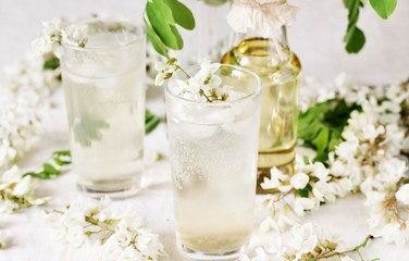 acacia flowers drink. lemonade with a syrup of white acacia flowers. Edible flowers.