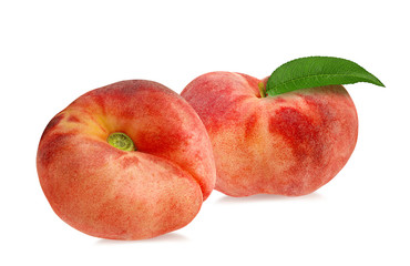 Two chinese flat donut peaches with leaf isolated on white with clipping path