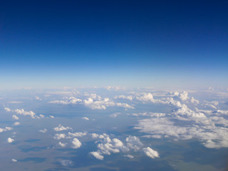 Fototapeta na wymiar Top view of the earth with clouds. Hot air balloon trip. Extreme tourism in the form of flights on unusual aircraft.