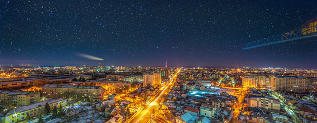 Night city on the background of the starry sky
