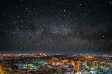 Night city on the background of the starry sky