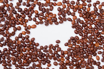White background with coffee beans scattered around. Free space for text.