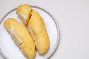 Close up Durian Chani pulp with seeds in a plate with white background