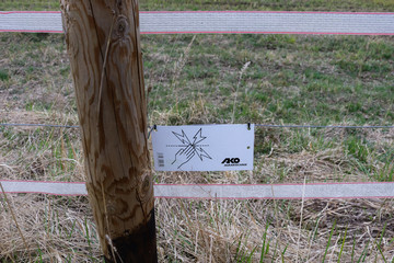 Attached small sign that there is electricity