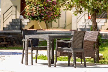 Wicker table and chairs on street