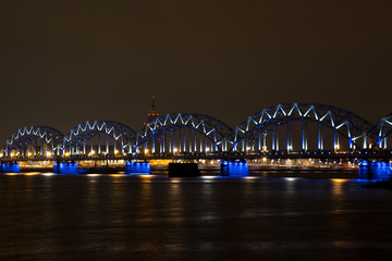 Bridge through the river with blue led lights.