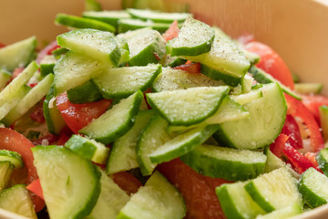 Vegetable salad cucumber tomato closeup.