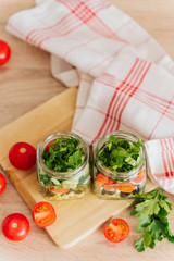 Healthy Homemade Jar Salad with cucumbers and tomatoes. Healthy food, Diet, Detox, Clean Eating or Vegetarian concept.