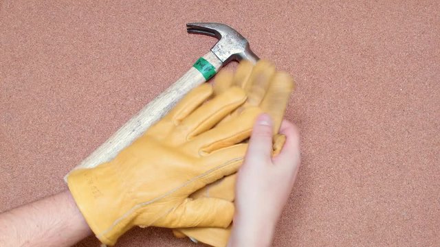 Taking Off Security Gloves and putting them over a cork surface