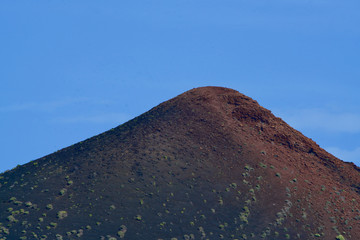 Volcano under a blue sky