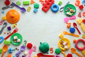 Fototapeta na wymiar Children's toys and accessories on a white background. View from above