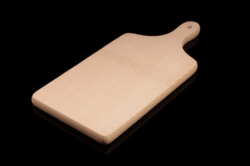 Cutting board made from wood isolated on the black