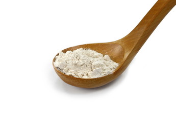 Fototapeta na wymiar Pile of integral spelt wheat flour in wooden spoon isolated on white background