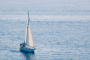 boat sailing on the wide blue sea