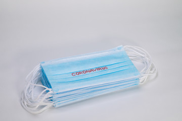 COVID-19. Facial masks on the pile. Epidemic background. Shortage of facial masks at drug store. Quarantine background. Medical masks for protection. Dangerous virus. 