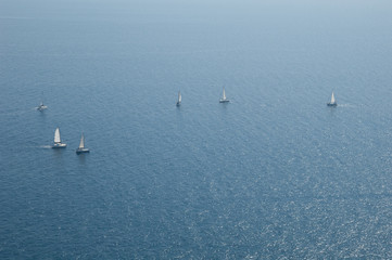 Naklejka premium Sailing regatta in the coast of Mogan. Gran Canaria. Canary Islands. Spain.