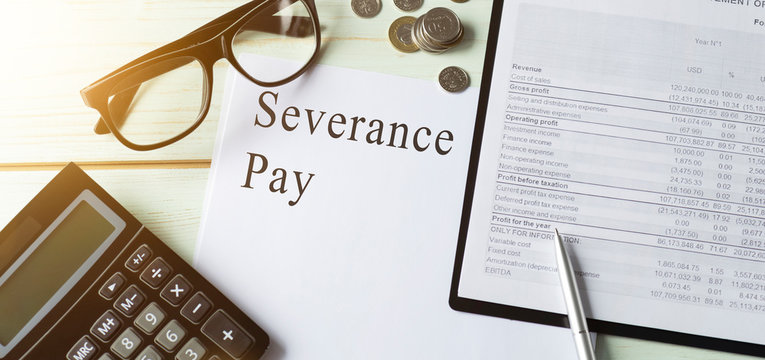 Paper with Severance Pay on a table