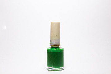 green Nail polish bottle on white background