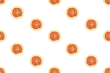 Seamless pattern of isolated slices of grapefruit. Wallpaper for background, design and packaging.