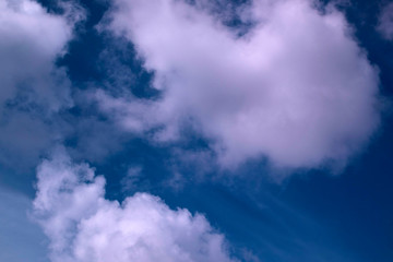 Large fluffy white clouds on the sky. Slow motion. Slowly moving clouds.