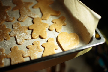 a little boy helps bake cookies