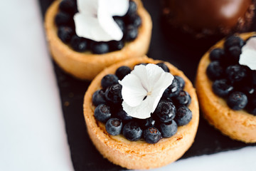 photo of good looking delicious blueberry small tarts