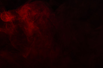 Fototapeta premium Red steam on a black background.