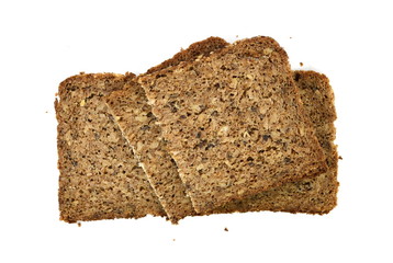 Slices of wholemeal dark bread isolated on a white background in close-up 