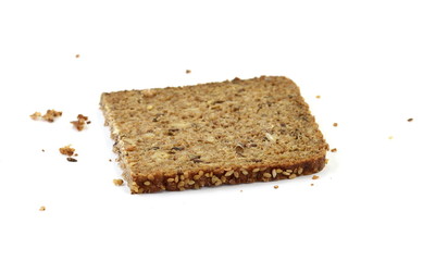 Slices of wholemeal dark bread isolated on a white background in close-up 