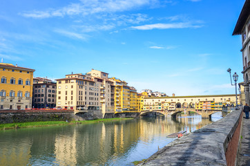 Famous Ponte Vecchio Bridge, medieval stone bridge over the Arno River in Florence, Tuscany, Italy. Major landmark of the Italian city. Amazing cityscape. Historical center, old town