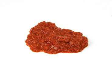 Traditional Italian red pesto isolated on white from above.