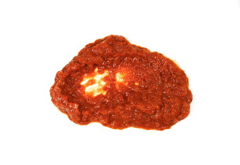 Traditional Italian red pesto isolated on white from above.