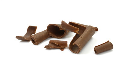 Chocolate Curls Isolated On White Background. Group of chocolate shavings. CHOCOLATE ROLL.
