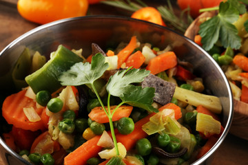 stir fried vegetables from a chinese wok in a bowl with carrot and mushrooms