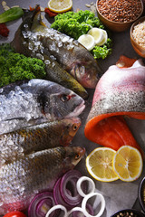Different sorts of fish on kitchen table