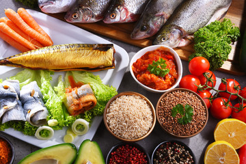 Different sorts of fish on kitchen table