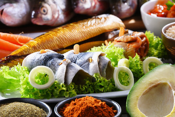 Different sorts of fish on kitchen table