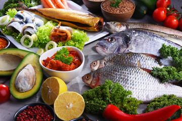 Different sorts of fish on kitchen table