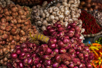 Baskets with garlic and onion on the traditional  street market, Hanoi, Vietnam.