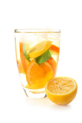 Glass of tasty cold ice tea on white background